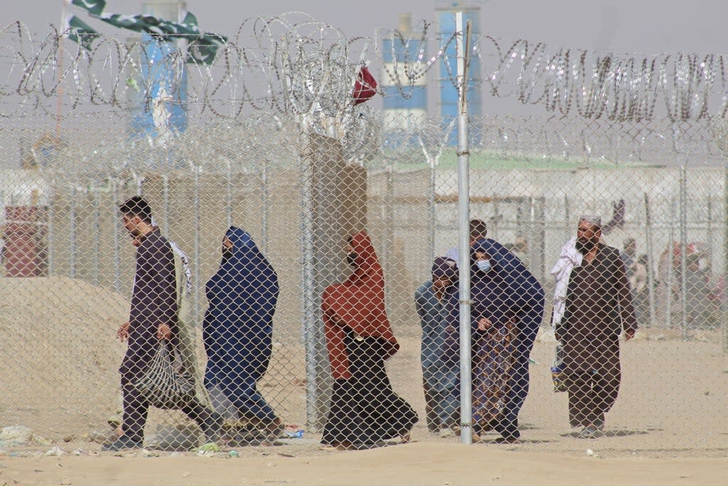 Afghan nationals crossing into Pakistan  (AFP via Getty)
