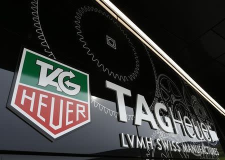 The Tag Heuer logo is seen at the entrance of their new watch manufactory in Chevenez November 5, 2013. REUTERS/Ruben Sprich