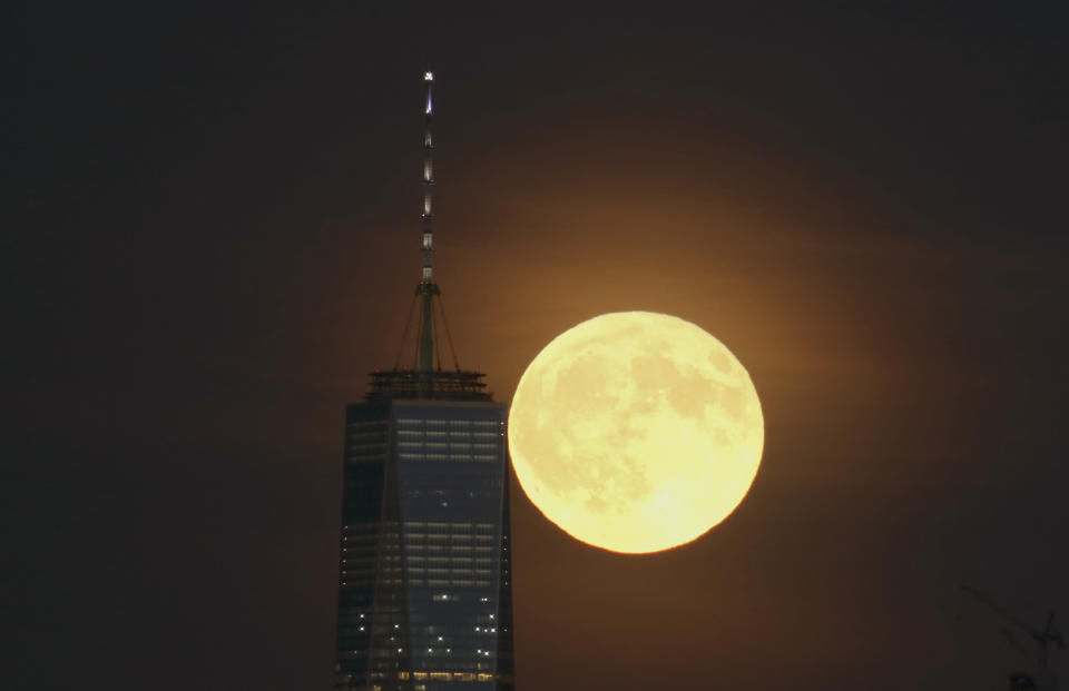 NEWARK, NJ - SEPTEMBER 16: A full harvest moon rises over One World Trade Center