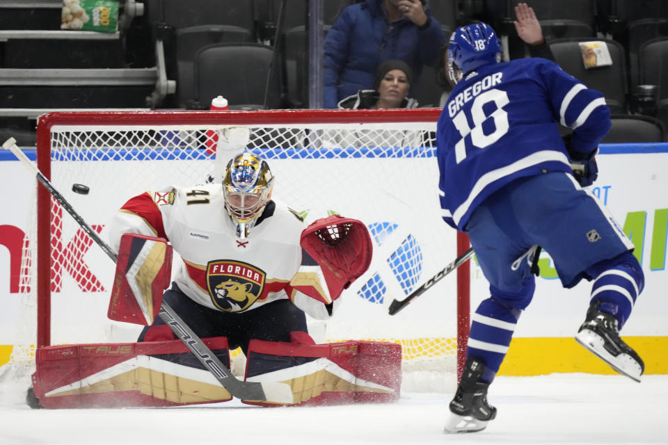 Toronto Maple Leafs center Noah Gregor (18) scores the game winning goal against Florida Panthers goaltender Anthony Stolarz (41) during a shootout during an NHL hockey game in Toronto on Tuesday, Nov. 28, 2023. (Frank Gunn/The Canadian Press via AP)