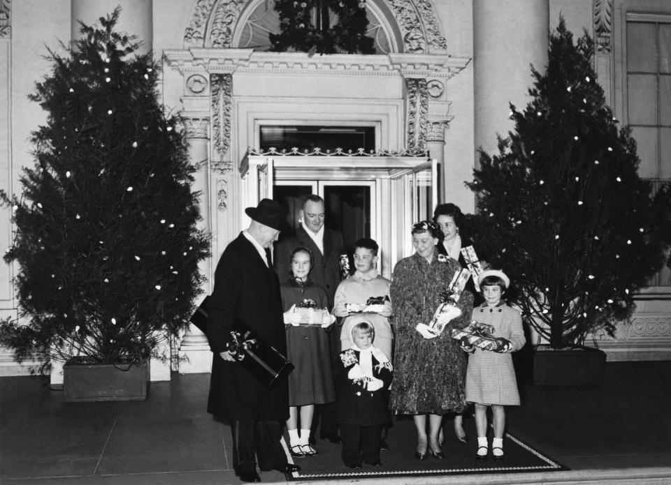 <p>President Eisenhower poses for a Christmas portrait with his family outside the White House. </p>