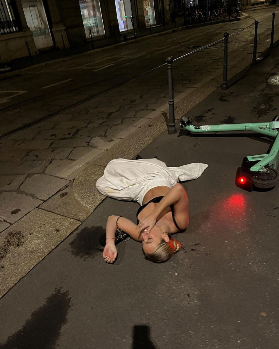 Cassidy McGill lying on the road in Milan