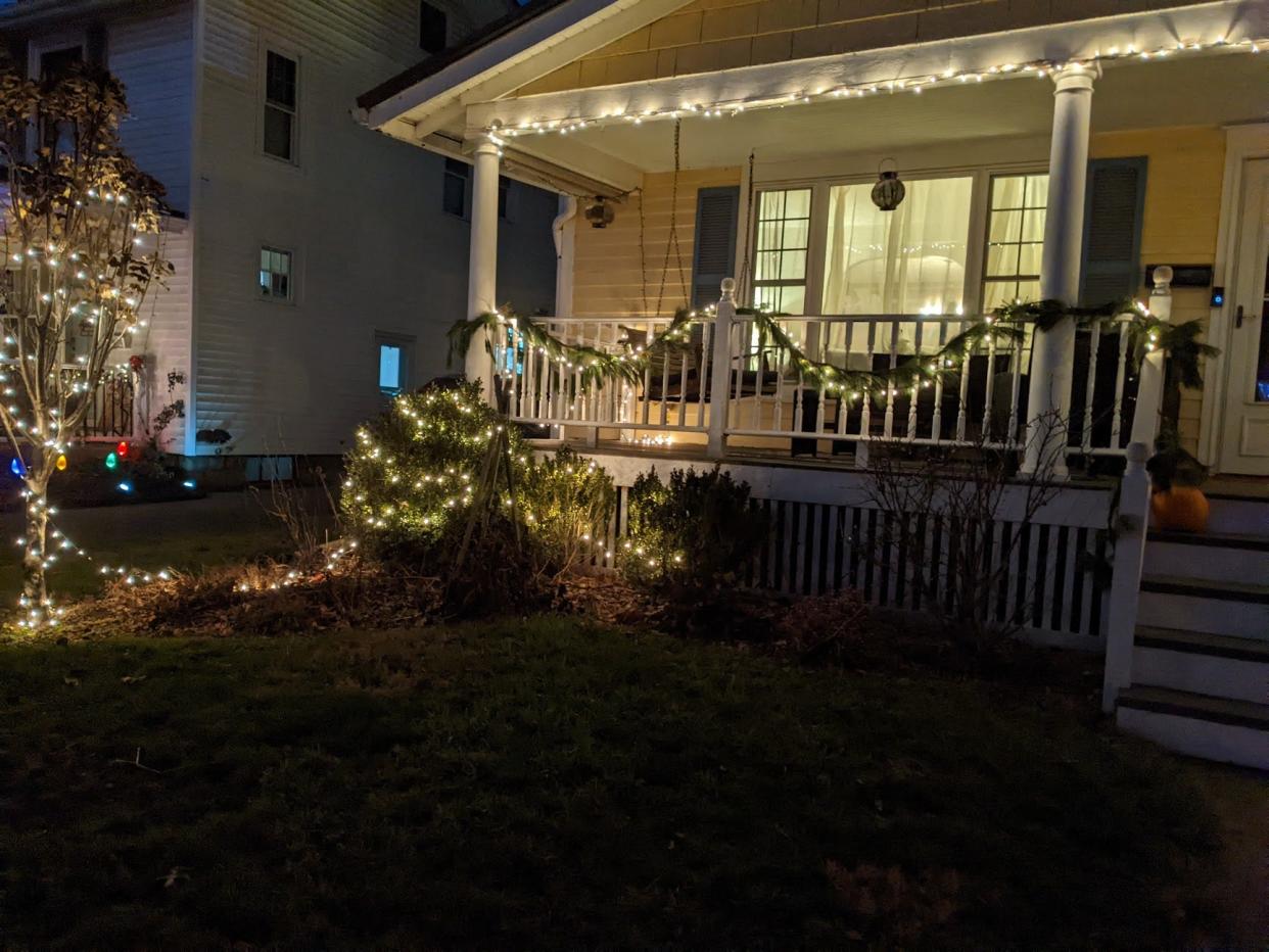 The Roy family's half-lit front yard, which is at least decorated early.