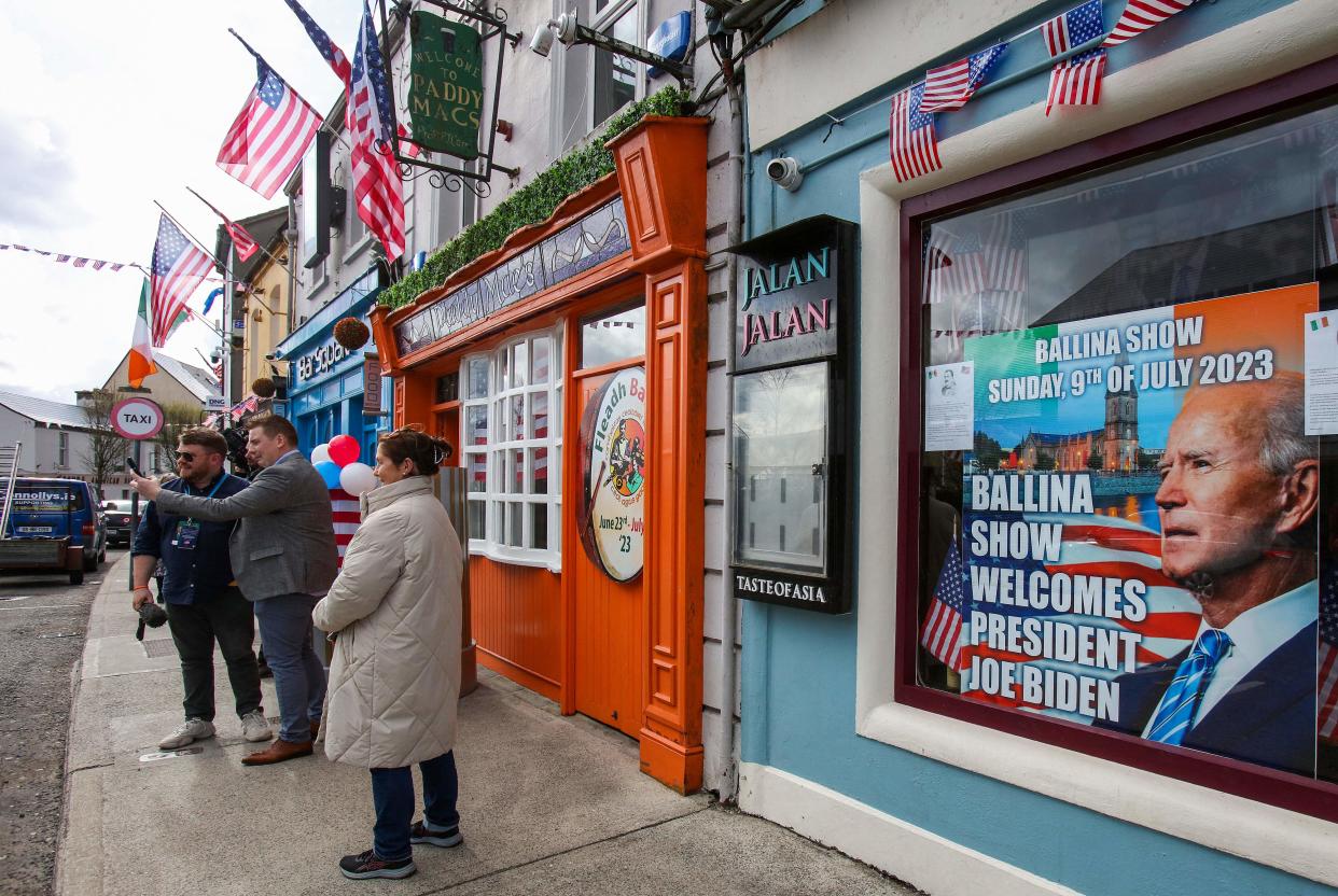 A shop in Ballina has displayed a poster of Joe Biden in its window (Paul Faith/AFP via Getty Images)