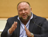 Infowars founder Alex Jones takes the witness stand to testify at the Sandy Hook defamation damages trial at Connecticut Superior Court in Waterbury, Conn. Thursday, Sept. 22, 2022. Jones was found liable last year by default for damages to plaintiffs without a trial, as punishment for what the judge called his repeated failures to turn over documents to their lawyers. The six-member jury is now deciding how much Jones and Free Speech Systems, Infowars’ parent company, should pay the families for defaming them and intentionally inflicting emotional distress. (Tyler Sizemore/Hearst Connecticut Media via AP, Pool)