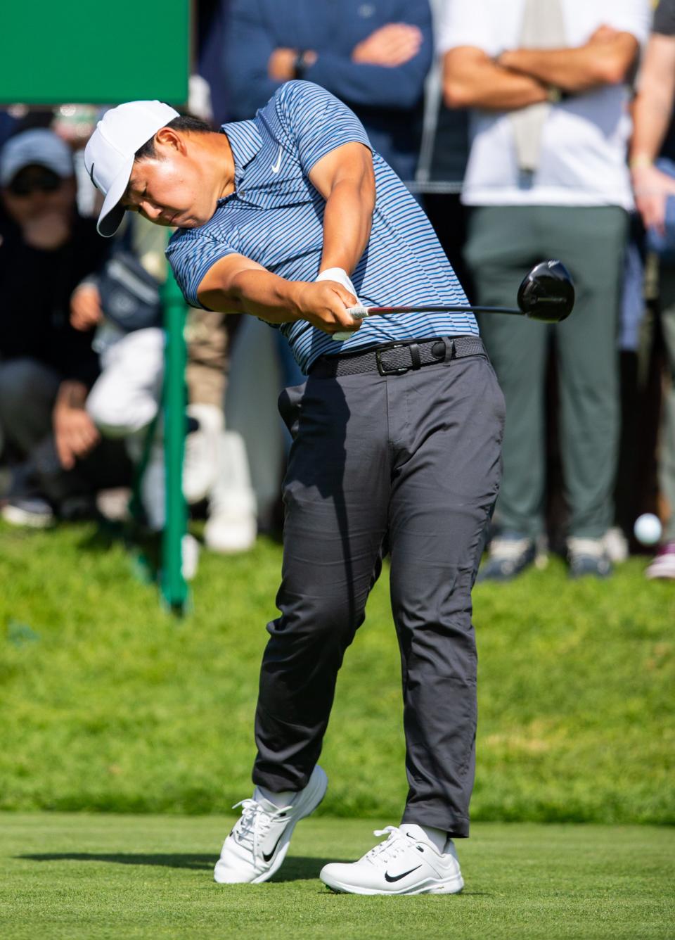 Feb 15, 2024; Pacific Palisades, California, USA; Tom Kim plays on the tenth hole during the first round of The Genesis Invitational golf tournament. Mandatory Credit: Jason Parkhurst-USA TODAY Sports