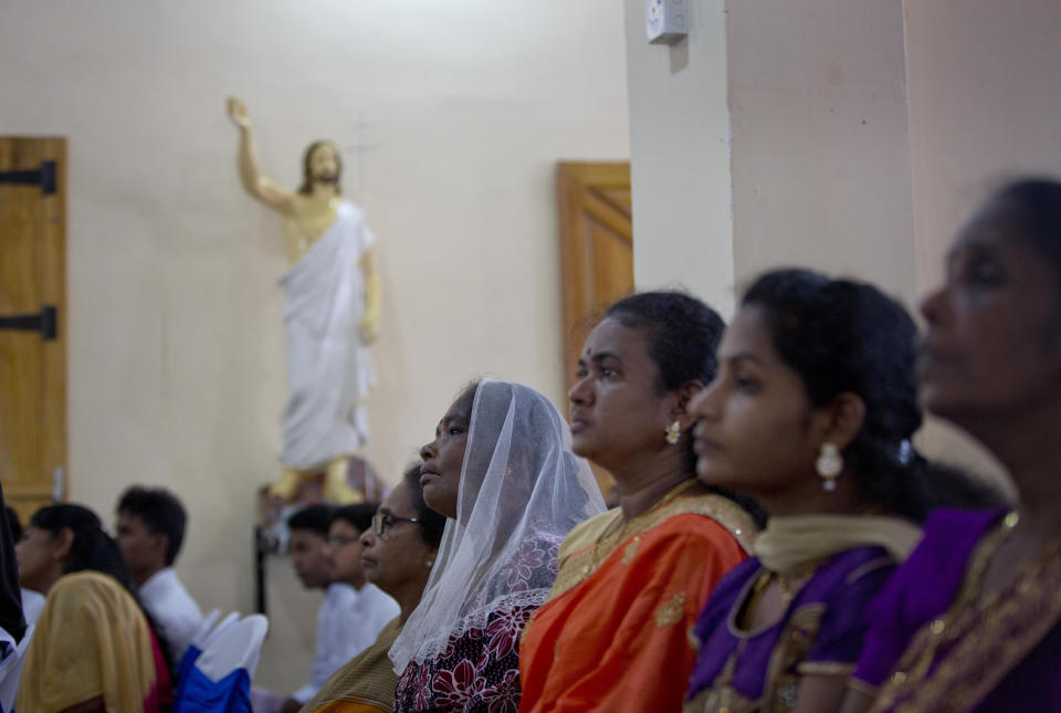 Catholics participate in Holy Mass at St. Joseph's church in Thannamunai, Sri Lanka, Tuesday, April 30, 2019. This small village in eastern Sri Lanka has held likely the first Mass since Catholic leaders closed all their churches for fear of more attacks after the Easter suicide bombings that killed over 250 people. (AP Photo/Gemunu Amarasinghe)