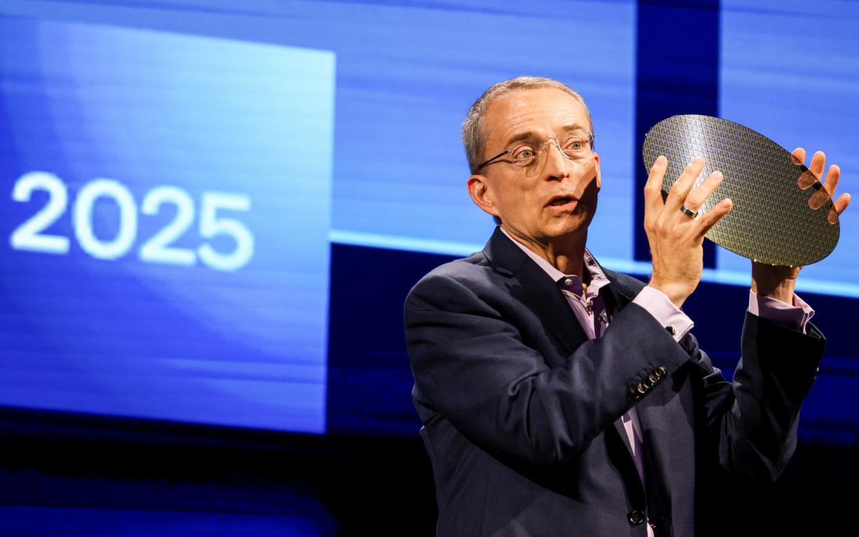 Intel chief Pat Gelsinger holds a sample of a chip wafer during his speech at Computex 2024 in Taipei in June