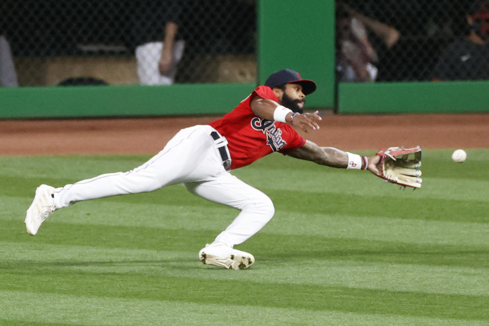 Cleveland Indians' Delino DeShields makes a diving attempt on a double by Pittsburgh Pirates' Ke'Bryan Hayes during the third inning of a baseball game, Saturday, Sept. 26, 2020, in Cleveland. (AP Photo/Ron Schwane)