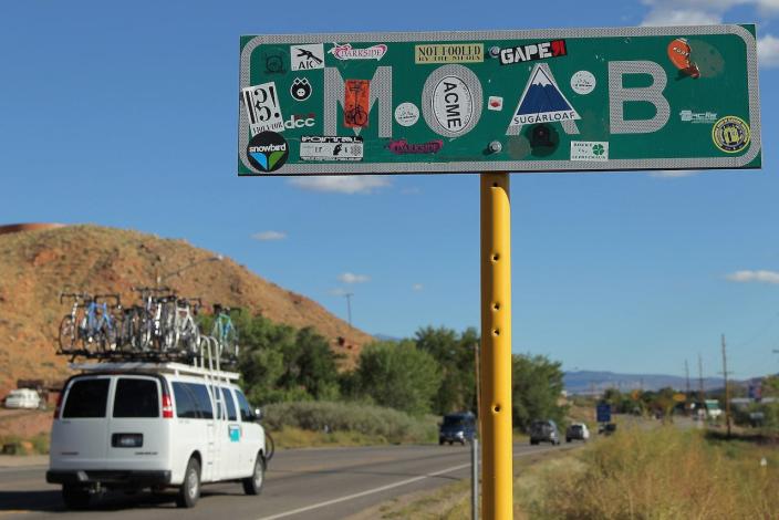 An ammended city limit sign welcomes visitors to town including more than 1000 mountain bikers competing in the 2010 24 Hours of Moab on October 8, 2010 in Moab, Utah.