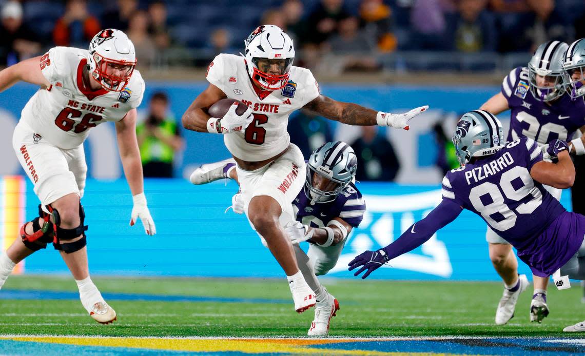 N.C. State’s Trent Pennix (6) breaks free to score on a 60-yard fake punt during the second half of Kansas State’s 28-19 victory over N.C. State in the Pop-Tarts Bowl at Camping World Stadium in Orlando, Fla., Thursday, Dec. 28, 2023. Ethan Hyman/ehyman@newsobserver.com