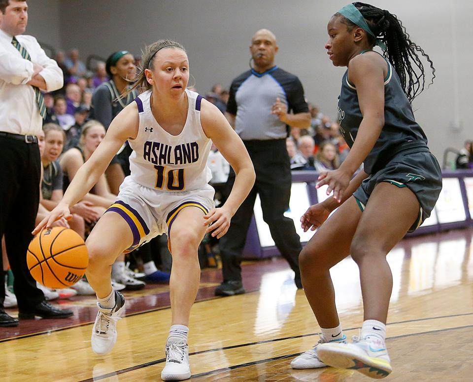 Ashland University's Hallie Heidemann (10) works with the ball against Tiffin University's Jada Tate (5) during college women's basketball action Saturday, Dec. 3, 2022. TOM E. PUSKAR/ASHLAND TIMES-GAZETTE