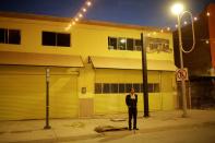 A musician stands on the street that leads to the Paso del Norte International Bridge in Mexico