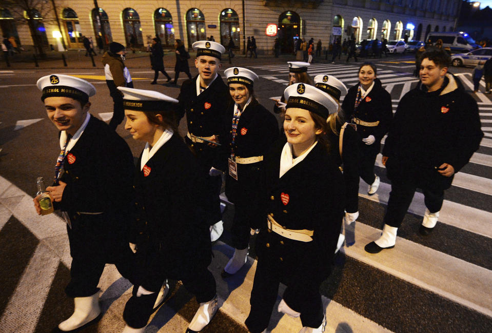 Sea-school students collected money as part of a charity's fundraising event to raise money for medical equipment for cash-strapped public hospitals, in Warsaw, Poland, Sunday, Jan. 12, 2020. This is the final day for the charity collection. (AP Photo/Czarek Sokolowski)