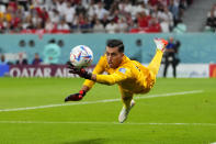 Tunisia's goalkeeper Aymen Dahmen reaches for the ball during the World Cup group D soccer match between Denmark and Tunisia, at the Education City Stadium in Al Rayyan , Qatar, Tuesday, Nov. 22, 2022. (AP Photo/Petr David Josek)