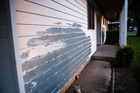 FILE PHOTO: Siding peels from the exterior of a home in the Pershing Park Fort Hood Family Housing subdivision, in Fort Hood, Texas, U.S May 16, 2019. REUTERS/Amanda Voisard