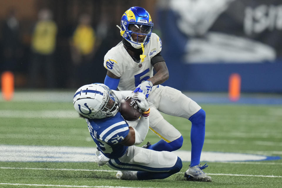 Indianapolis Colts cornerback Kenny Moore II, below, intercepts a pass intended for Los Angeles Rams wide receiver Tutu Atwell during the second half of an NFL football game, Sunday, Oct. 1, 2023, in Indianapolis. (AP Photo/Michael Conroy)
