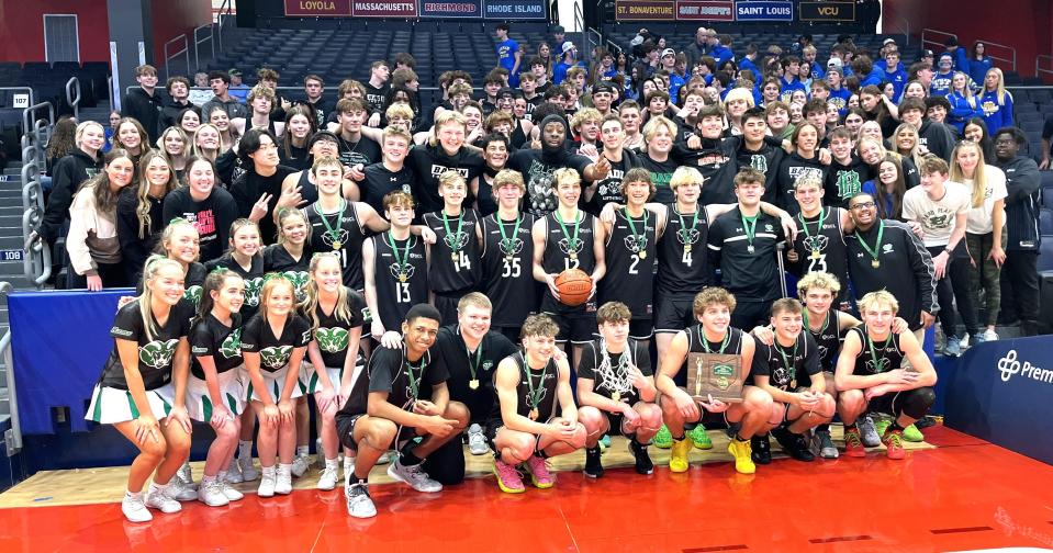 Badin players pose with cheerleaders and student fans after winning the district championship during the OHSAA Division II boys district championship games March 9, 2024 at University of Dayton Arena.