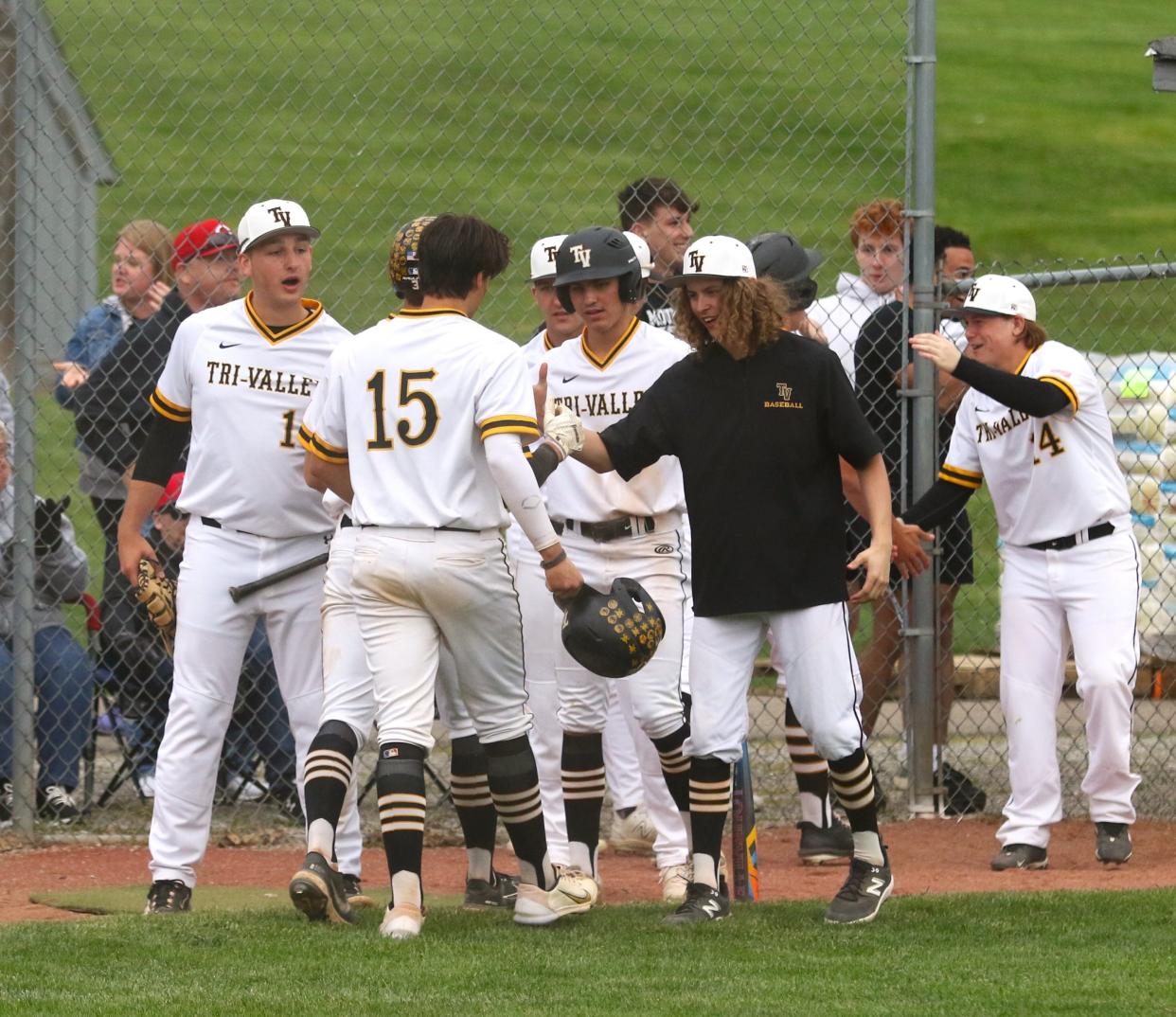 Tri-Valley players celebrate after Kade Hindel's three-run double provided some breathing room in Tuesday's 4-1 win over Sheridan at Kenny Wolford Park.