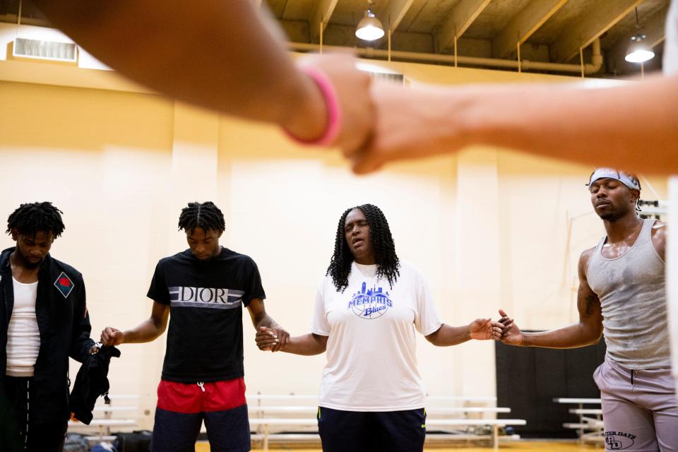 Alondray Rogers leads the team in prayer during a practice for Memphis Blues, a semi-pro basketball team Rogers owns and coaches, at Penny’s Gym in Memphis, Tenn., on Monday, April 1, 2024. The team offers a chance for area basketball players to extend their careers after college with hopes of landing on a professional team whether in the U.S. or abroad.