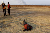 A man sleeps on the ground in Thonyor, Leer state, South Sudan, February 26, 2017. REUTERS/Siegfried Modola