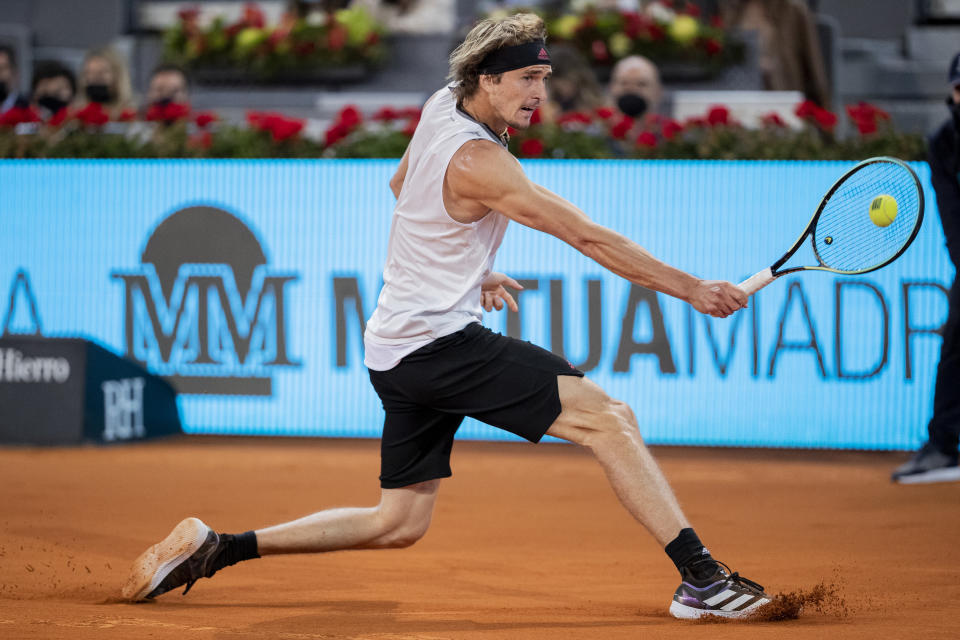 Germany's Alexander Zverev returns the ball to Italy's Matteo Berrettini during the men's final match at the Mutua Madrid Open tennis tournament in Madrid, Spain, Sunday, May 9, 2021. (AP Photo/Bernat Armangue)