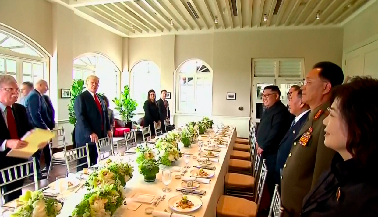 Donald Trump and Kim Jong-un prepare to sit down for lunch (Picture: PA)