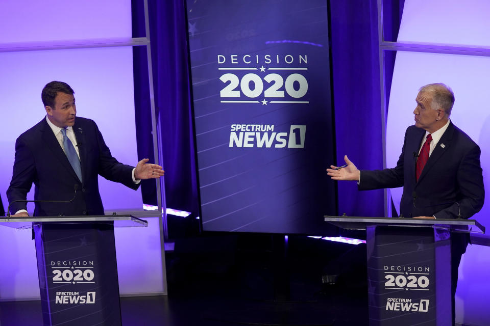 File: Democratic challenger Cal Cunningham, left, and U.S. Sen. Thom Tillis, R-N.C. talk during a televised debate Thursday, October 1, 2020 in Raleigh, N.C. / Credit: Gerry Broome / AP