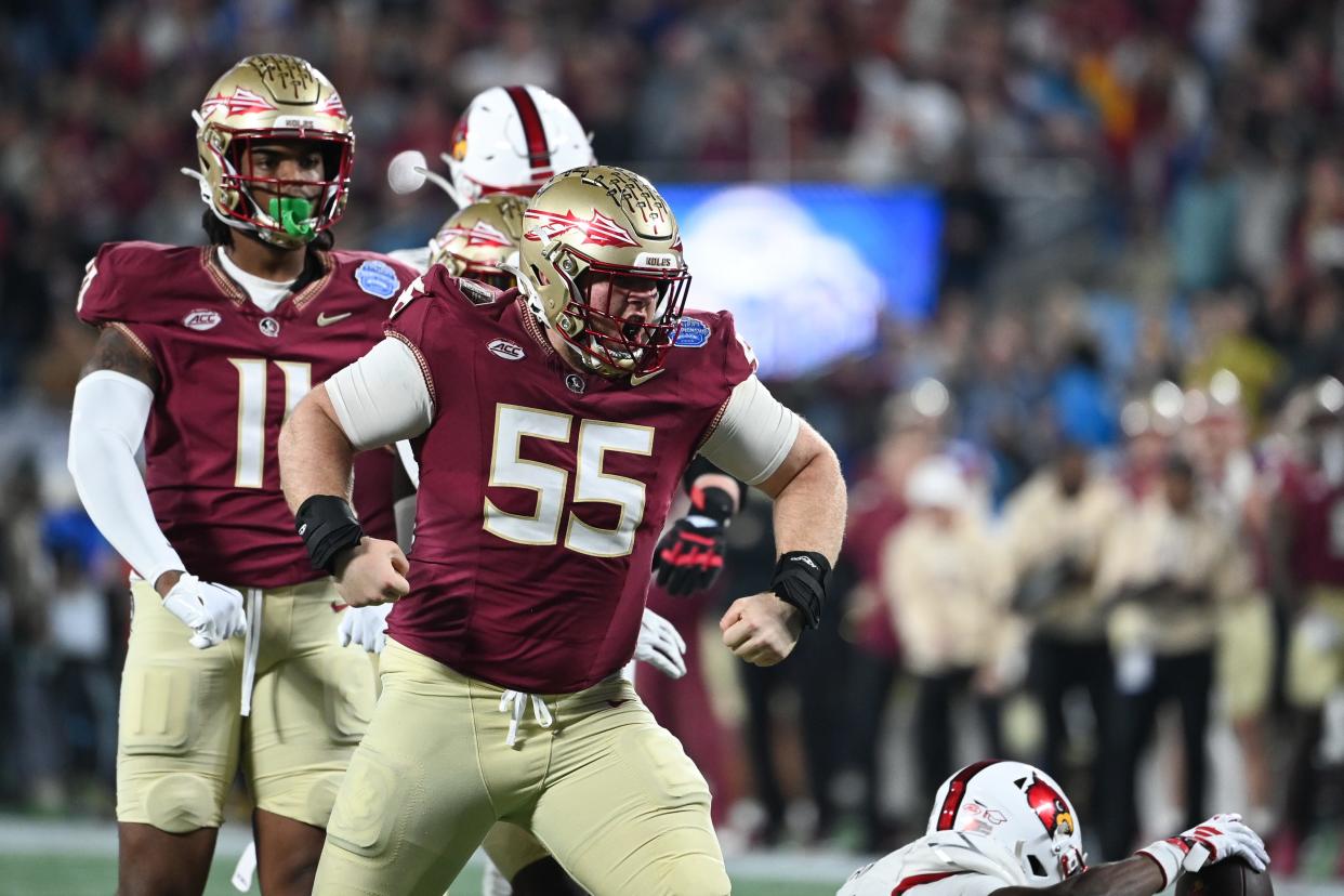 ACC: Florida State defensive lineman Braden Fiske (55) reacts after a tackle on Louisville running back Jawhar Jordan (25).