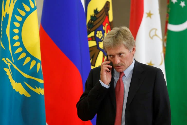 Kremlin spokesman Dmitry Peskov speaks on the phone before a session of the Council of Heads of the Commonwealth of Independent States (CIS) in Sochi on October 11, 2017