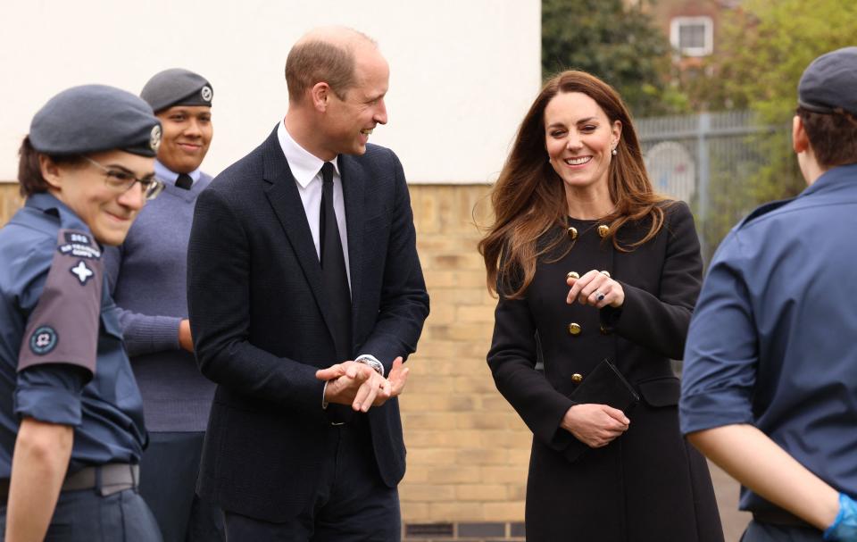 Britain's Prince William, Duke of Cambridge, and Britain's Catherine, Duchess of Cambridge, wearing black as a mark of respect following the death of Britain's Prince Philip, Duke of Edinburgh, meet air Cadets during their visit to 282 (East Ham) Squadron Air Training Corps in east London on April 21, 2021. - During the visit, the Squadron paid tribute to The Duke of Edinburgh, who served as Air Commodore-in-Chief of the Air Training Corps for 63 years. In 2015, The Duke passed the military patronage to The Duchess of Cambridge who became Honorary Air Commandant. (Photo by Ian Vogler / POOL / AFP) (Photo by IAN VOGLER/POOL/AFP via Getty Images)