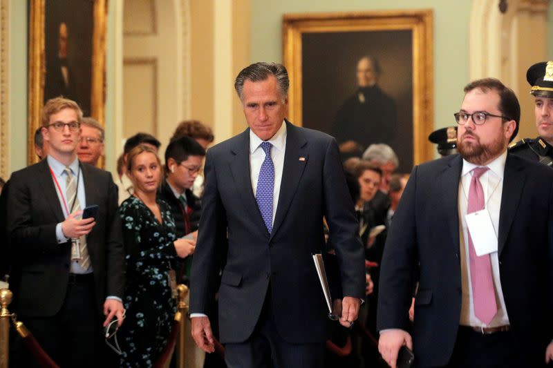 FILE PHOTO: U.S. Senator Romney (R-UT) walks from Trump impeachment trial during recess on Capitol Hill in Washington