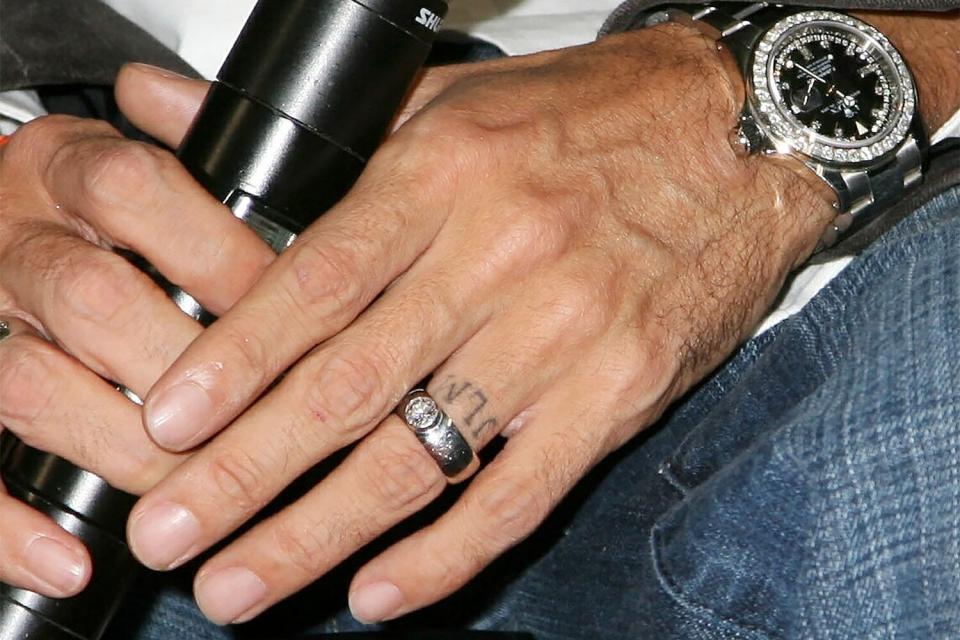 Mandatory Credit: Photo by Greg Allen/Shutterstock (697286q) Marc Anthony's 'JLM' tattoo on wedding ring finger Press conference for 'En Concierto' tour, PS36 Union Port School, Bronx, New York, America - 25 Sep 2007