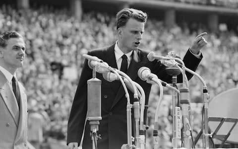 Graham speaking at the Berlin Olympic Stadium in 1954 - Credit: Werner Kreusch /AP