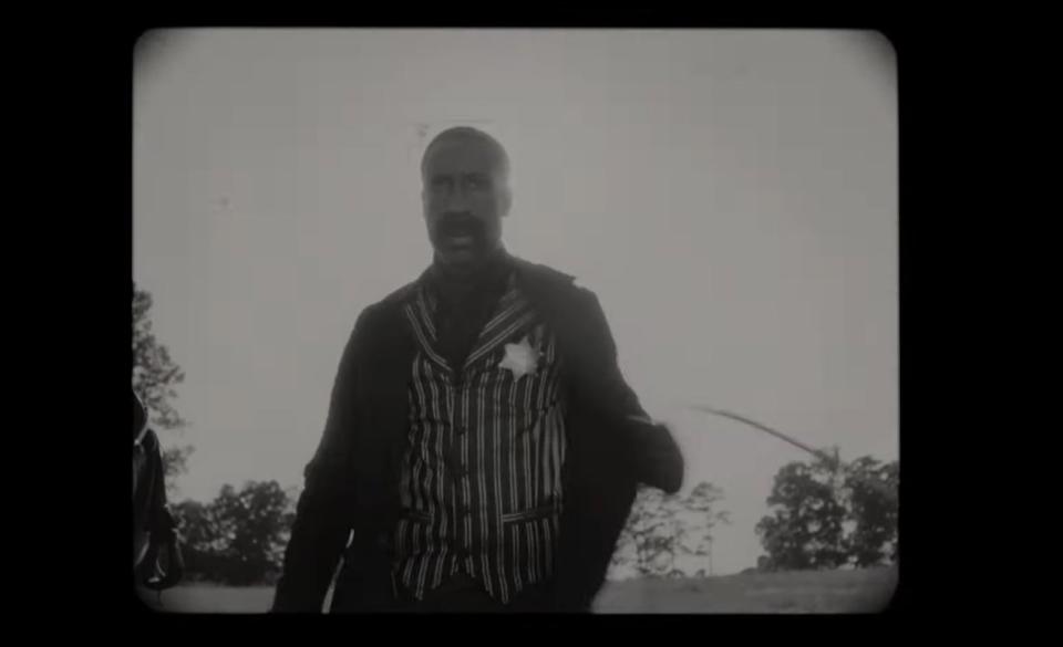 Bass Reeves in a black and white film in "Watchmen" (2019)