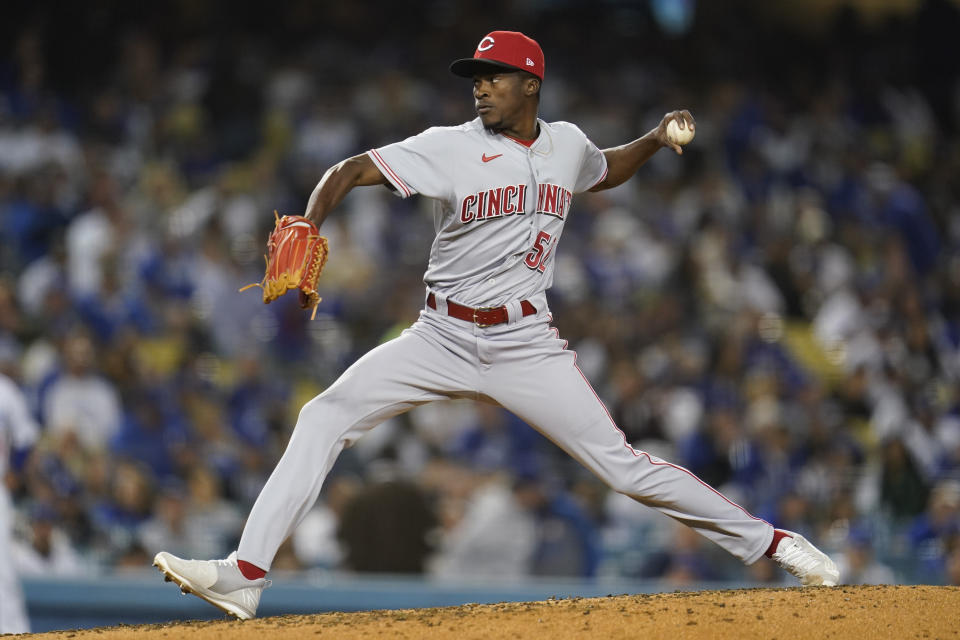 Cincinnati Reds relief pitcher Reiver Sanmartin (52) throws during the third inning of a baseball game against the Los Angeles Dodgers in Los Angeles, Thursday, April 14, 2022. (AP Photo/Ashley Landis)