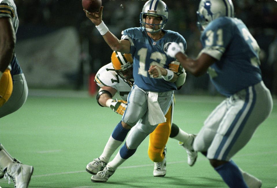 It's been 10,000 days since the Detroit Lions won a playoff game, when QB Erik Kramer, center, led the Lions past the Dallas Cowboys. (Getty Images) 