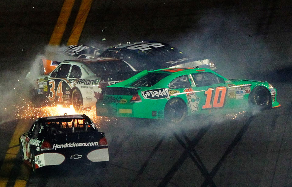 DAYTONA BEACH, FL - FEBRUARY 27: Danica Patrick, driver of the #10 GoDaddy.com Chevrolet, David Ragan, driver of the #34 Front Row Motorsports Ford, and Jimmie Johnson, driver of the #48 Lowe's Chevrolet, spin after an on track incident in the NASCAR Sprint Cup Series Daytona 500 at Daytona International Speedway on February 27, 2012 in Daytona Beach, Florida. (Photo by Tom Pennington/Getty Images for NASCAR)