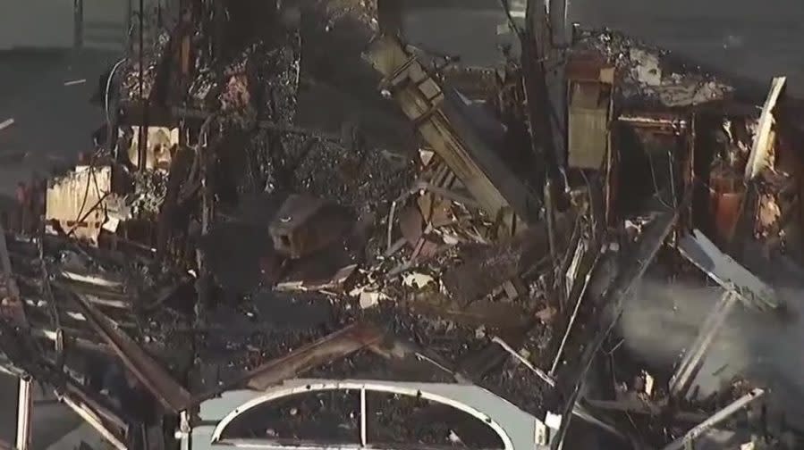 An aerial view of the former Ruby's diner at the Oceanside Pier on Friday, April 26, 2024 following a massive fire. (SkyFOX/KUSI in the Sky)