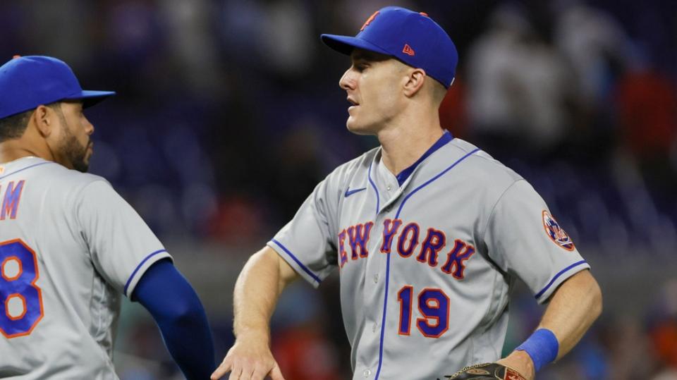 Apr 1, 2023; Miami, Florida, USA; New York Mets left fielder Mark Canha (19) celebrates with center fielder Tommy Pham (28) after winning the game against the Miami Marlins at loanDepot Park.