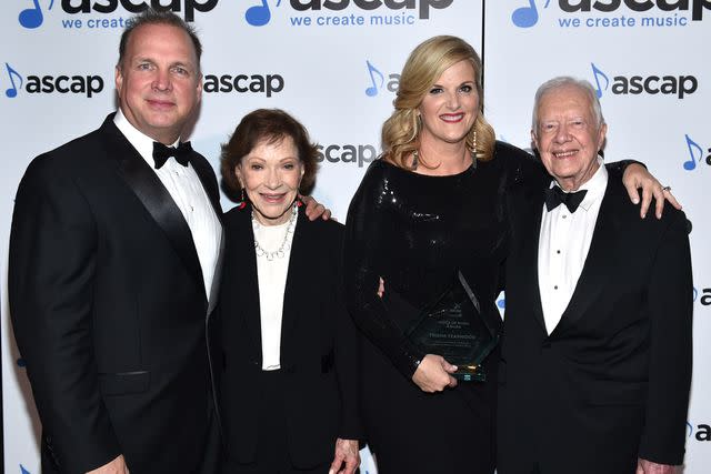 <p>John Shearer/Getty</p> Garth Brooks, Rosalynn Carter, Trisha Yearwood and President Jimmy Carter on Nov. 2, 2015 in Nashville