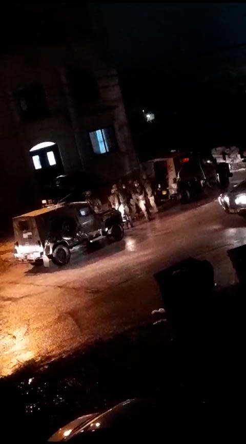 A video posted to social media by Samaher Esmail's son shows what the family said were armored IDF vehicles outside their home in the West Bank.  / Credit: Image provided by Samaher Esmail's family