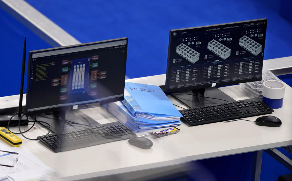 The monitors showing the ice system during the men's curling matches, at the 2022 Winter Olympics, Wednesday, Feb. 16, 2022, in Beijing. (AP Photo/Nariman El-Mofty)