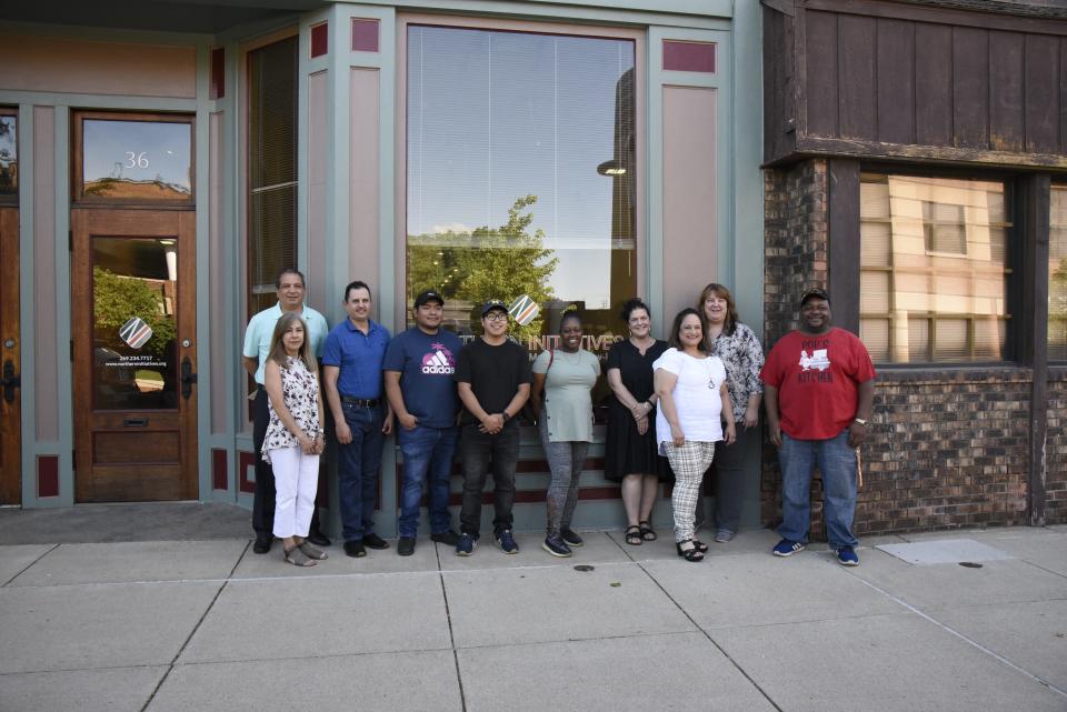 Members of the Northern Initiatives small business cohort pose for a photo in downtown Battle Creek during a graduation celebration from the entrepreneurship program on Thursday, June 2, 2022.