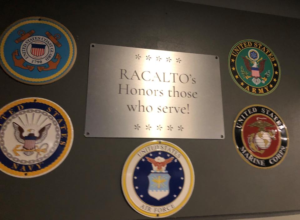 Racalto's new look includes wall plaques representing U.S. military branches, continuing a theme of honoring those on the front lines.