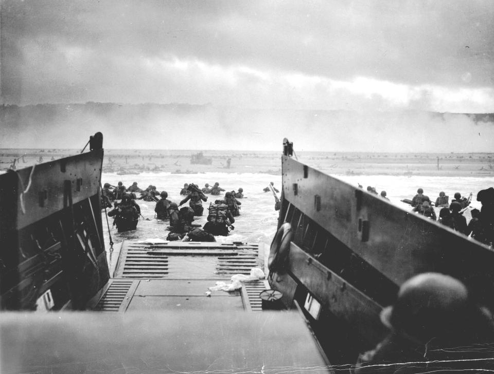 U.S. troops wade ashore from a Coast Guard landing craft at Omaha Beach during the Normandy D-Day landings near Vierville sur Mer, France, on June 6, 1944 in this handout photo provided by the US National Archives. On June 6, 1944, allied soldiers descended on the beaches of Normandy for D-Day - an operation that turned the tide of the Second World War against the Nazis, marking the beginning of the end of the conflict. Today, as many around the world prepare to commemorate the 70th anniversary of the landings, pictures of Normandy's now-touristy beaches stand in stark contrast to images taken around the time of the invasion. But while the landscape has changed, the memory of the momentous event lives on. Reuters photographer Chris Helgren compiled a series of archive pictures taken during the 1944 invasion and then went back to the same places, to photograph them as they appear today. Picture taken June 6, 1944. REUTERS/Robert F. Sargent/US National Archives/Handout via Reuters (FRANCE - Tags: ANNIVERSARY MILITARY CONFLICT) ATTENTION EDITORS - THIS PICTURE WAS PROVIDED BY A THIRD PARTY. REUTERS IS UNABLE TO INDEPENDENTLY VERIFY THE AUTHENTICITY, CONTENT, LOCATION OR DATE OF THIS IMAGE. THIS PICTURE IS DISTRIBUTED EXACTLY AS RECEIVED BY REUTERS, AS A SERVICE TO CLIENTS. FOR EDITORIAL USE ONLY. NOT FOR SALE FOR MARKETING OR ADVERTISING CAMPAIGNS. ATTENTION EDITORS: PICTURE 05 OF 34 FOR PACKAGE 'WWII - THE D-DAY LANDINGS, 70 YEARS ON' TO FIND ALL IMAGES SEARCH 'D-DAY HELGREN'