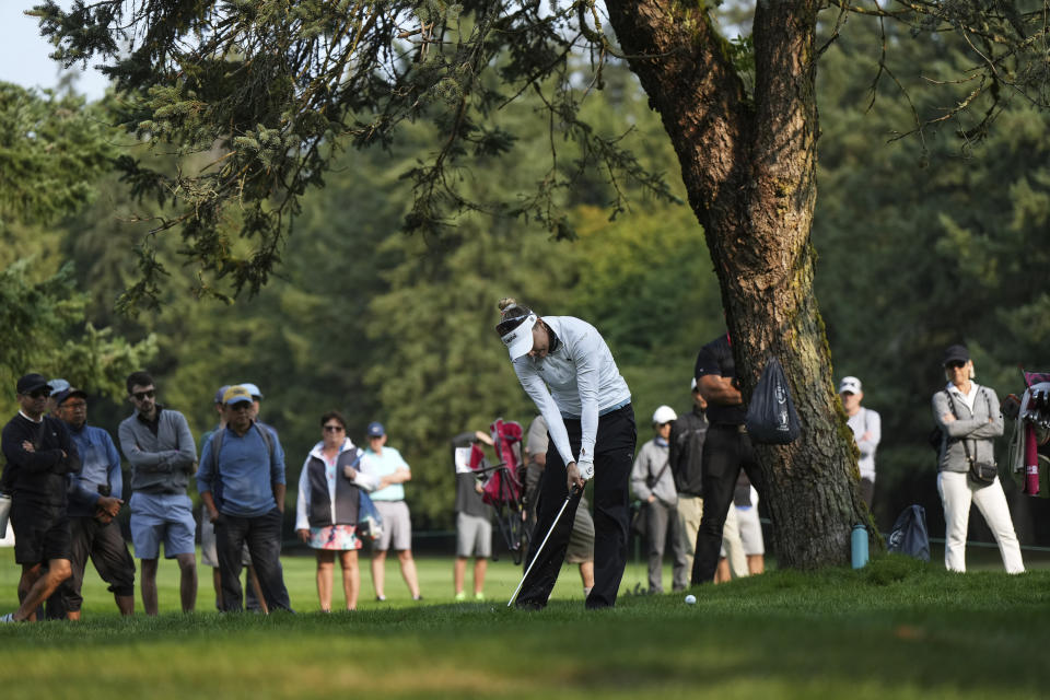 Lexi Thompson hits her second shot out of the rough on the 15th hole during the first round at the CPKC Canadian Women's Open golf tournament, in Vancouver, Thursday, Aug. 24, 2023. (Darryl Dyck/The Canadian Press via AP)