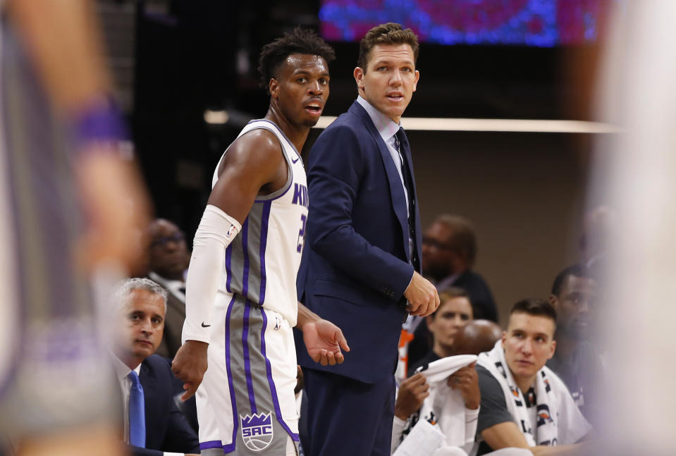 In this photo taken Oct. 10, 2019, Sacramento Kings head coach Luke Walton and Kings guard Buddy Hield watches the action during the second half of an NBA preseason basketball game against the Phoenix Suns in Sacramento, Calif. Hield, who was acquired when the Kings sent DeMarcus Cousins to the New Orleans Pelicans, led the team in scoring last season averaging 20.7 points per game. (AP Photo/Rich Pedroncelli)