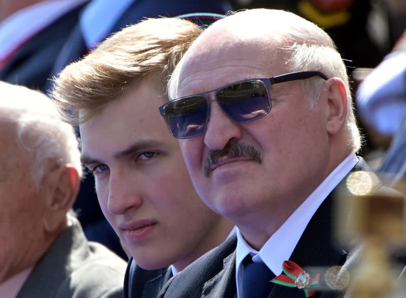 FILE PHOTO: Belarusian President Alexander Lukashenko and his son Nikolai attend the Victory Day Parade in Red Square in Moscow, Russia.