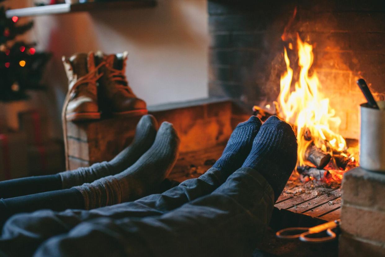 feet by fireplace